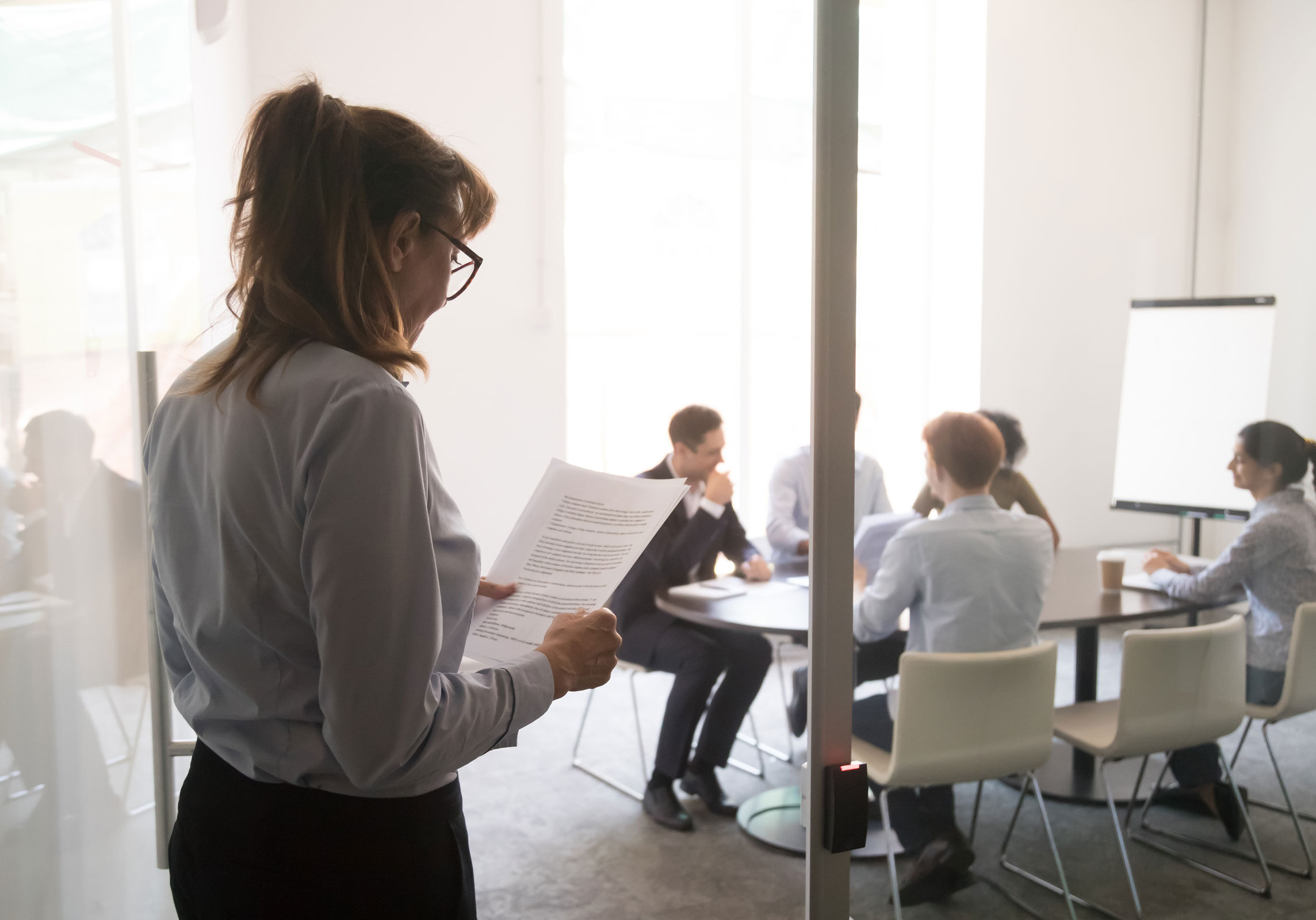 woman preparing for a presentation in a corporate setting